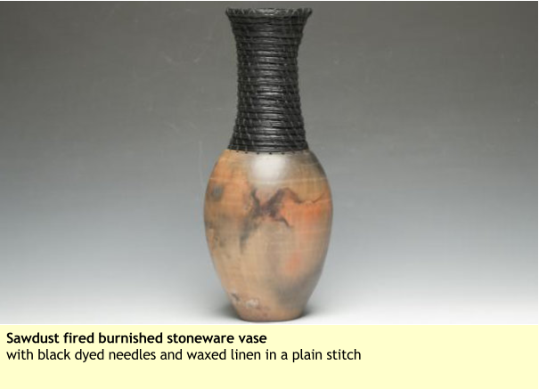 Sawdust fired burnished stoneware vase with black dyed needles and waxed linen in a plain stitch